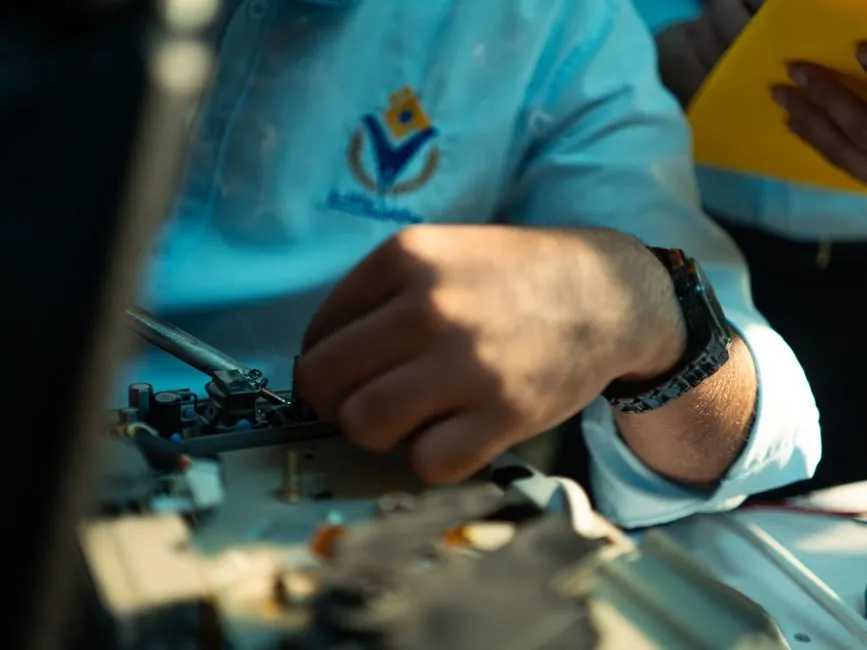 Close-up of a technician diagnosing a network printer issue