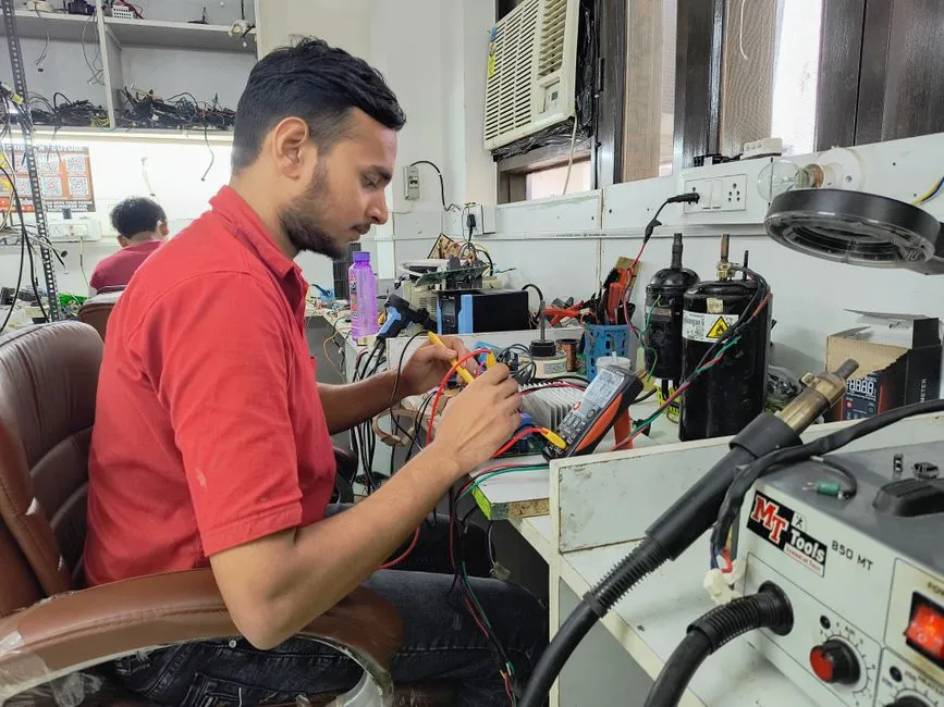 Technician repairing an office laser printer